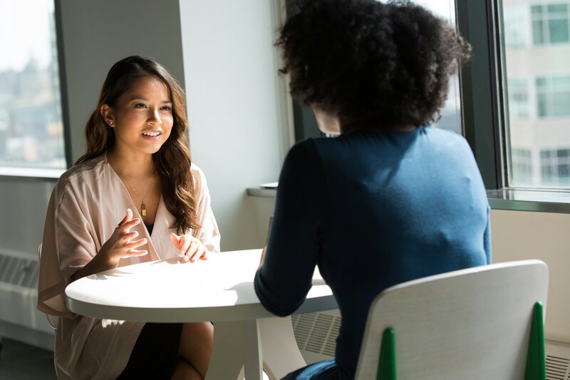 Young professional women in deep conversation