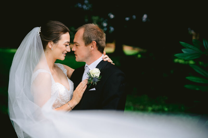 wrenbury hall wedding photo of bride and groom with wedding veil