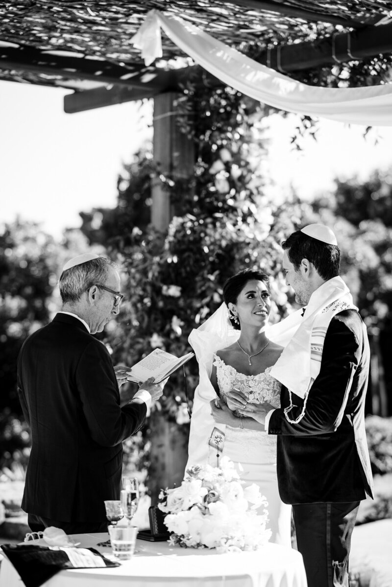Professional Bay Area destination wedding photographer captures Jewish ceremony at Carneros Resort with timeless black and white style