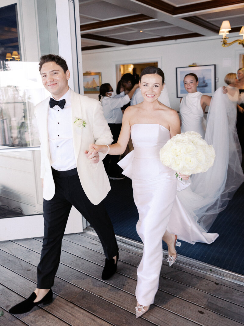 bride and groom holding  hands