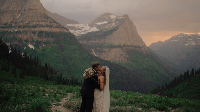 bride and groom on mountaintop