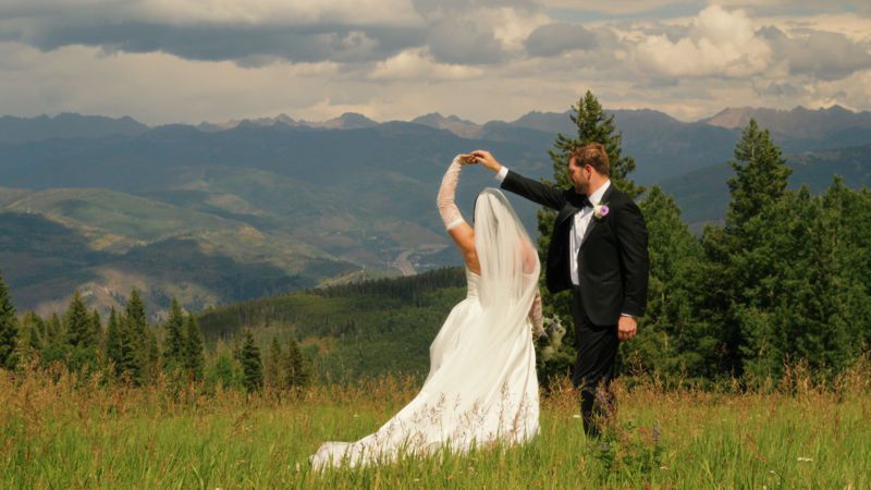 bride and groom holding hands
