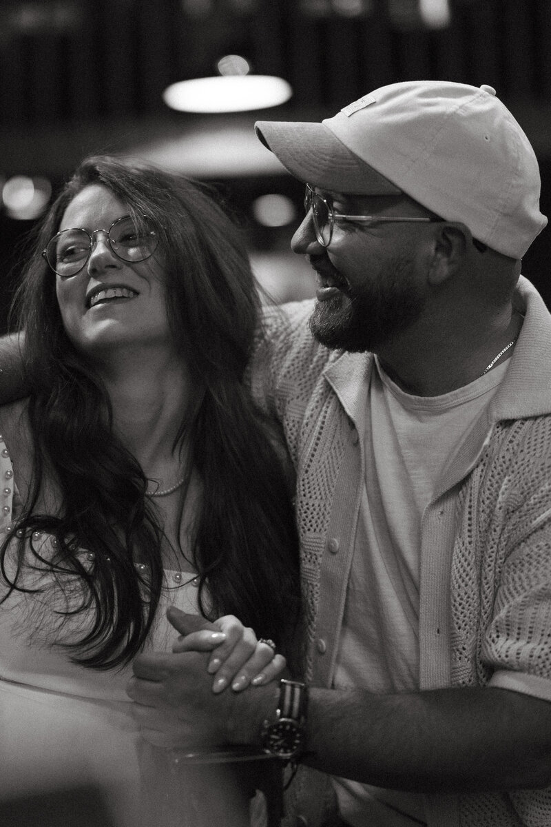 black and white photo of couple laughing