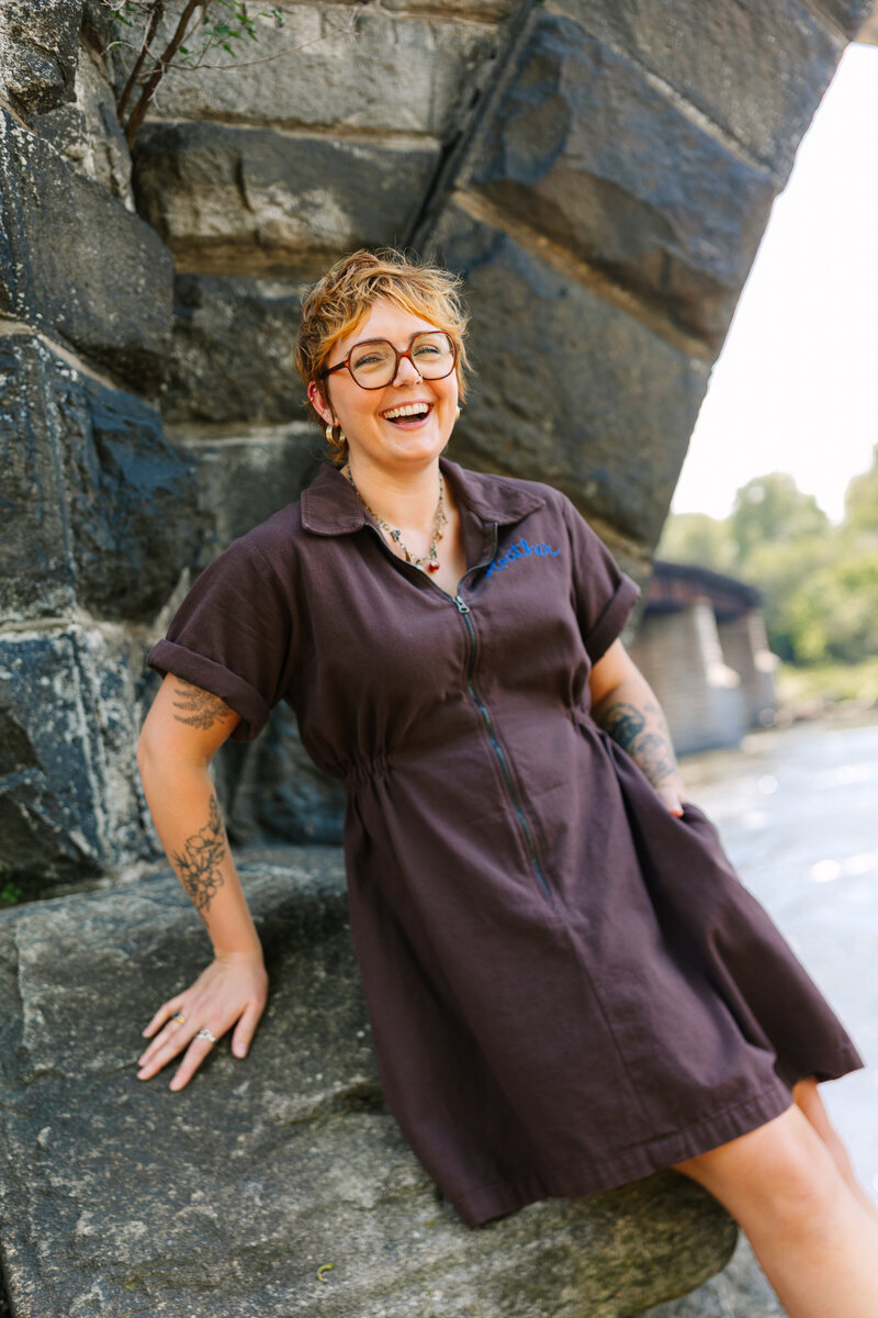 Philadelphia Photographer Heather McBride holding a camera.