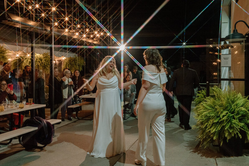 Hamilton LGTBQIA brides dancing at wedding