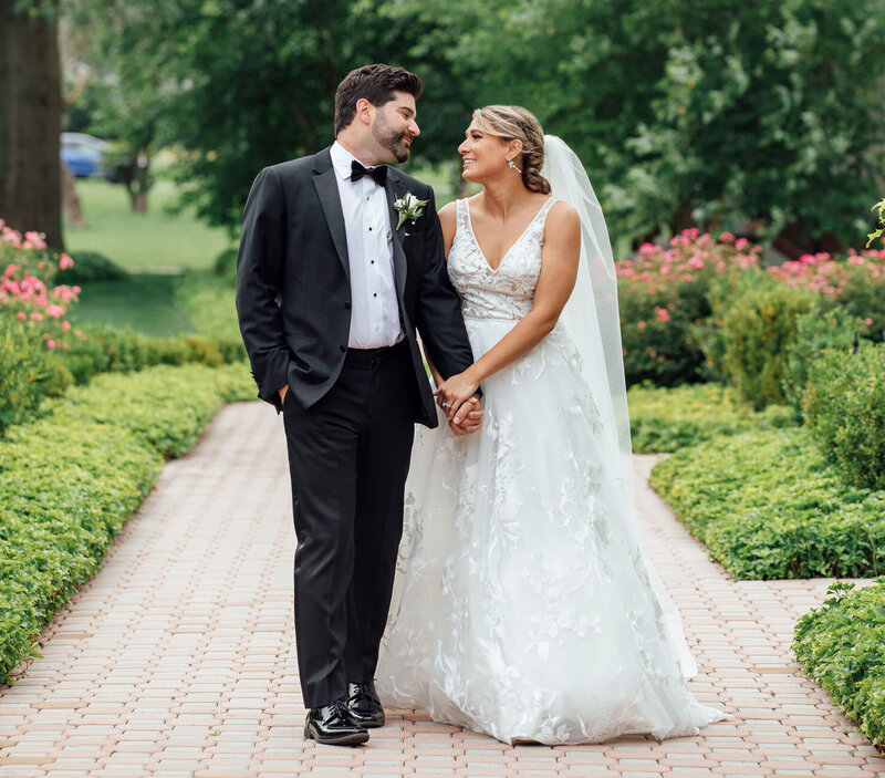 Ryland Inn Spring Wedding | Bride and Groom Walking Hand in Hand | Whitehouse Station, New Jersey