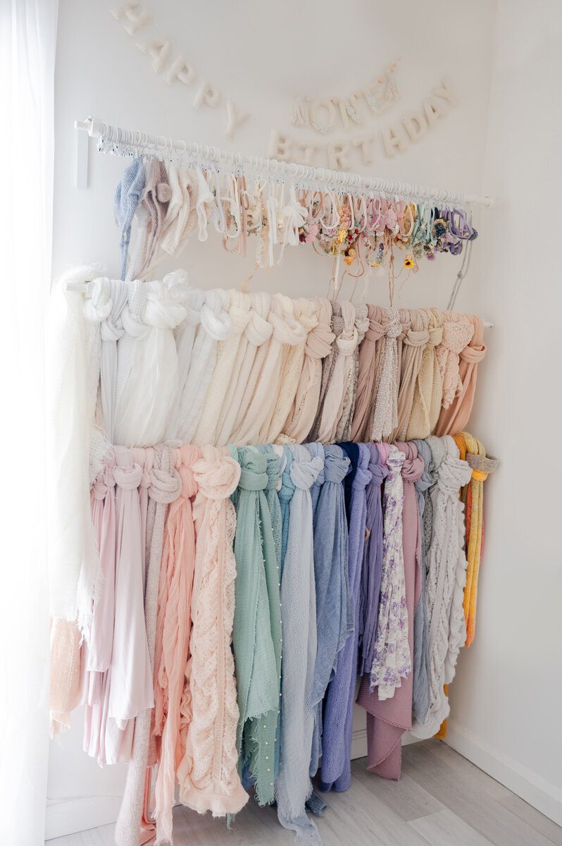 Wall of wraps and headbands in the studio