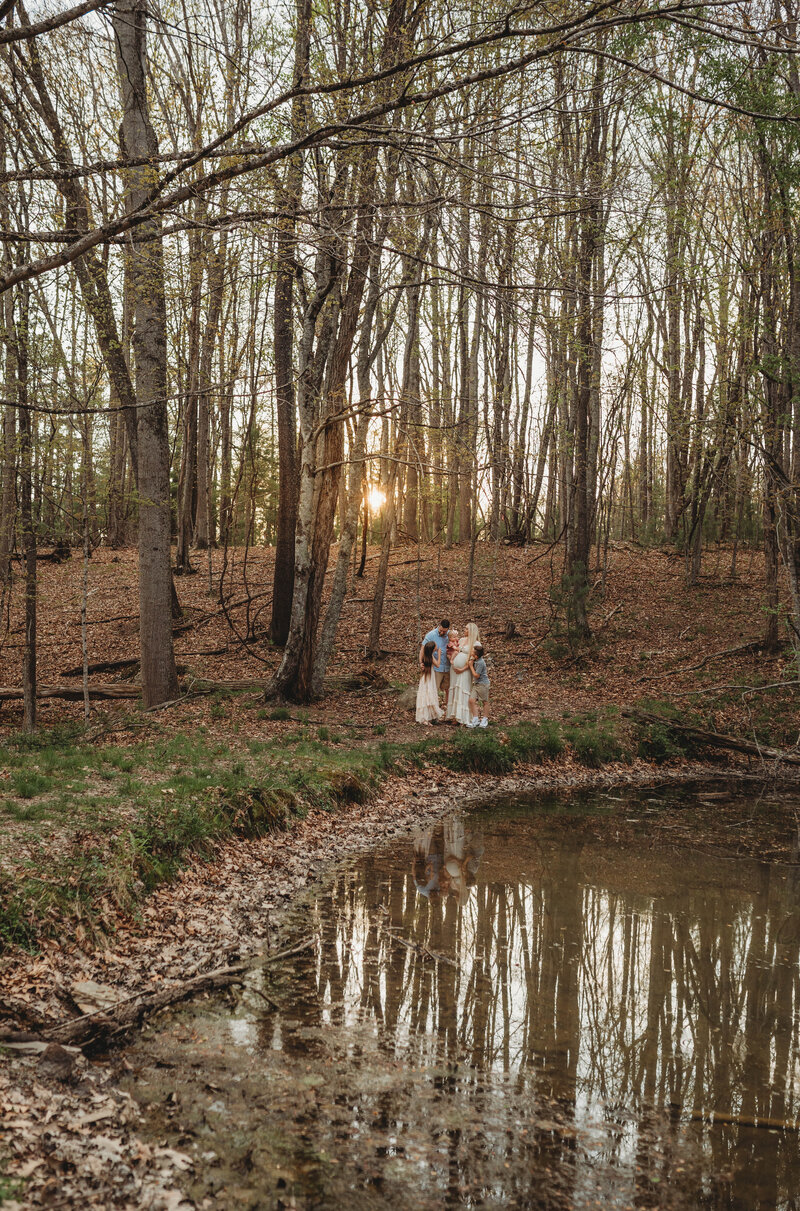 A family embracing one another at sunset during a Pipestem, West Virginia family session. 