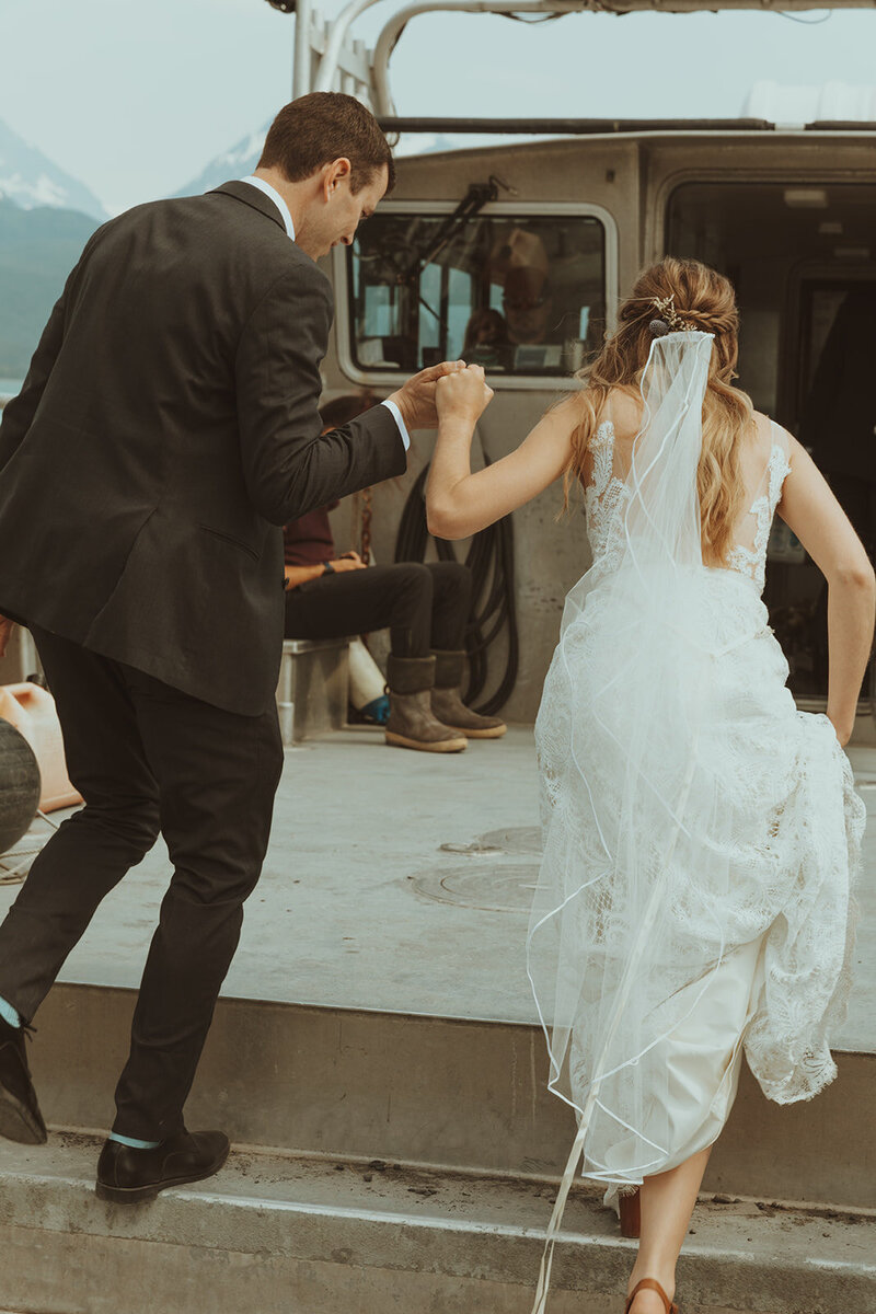 A wedding couple during their intimate boat elopement in the Pacific Northwest.