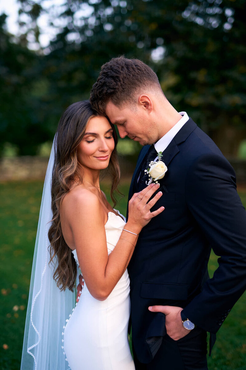 A groom posing in front of Wadsworth mansion in Middletown Connecticut for his wedding day portraits.