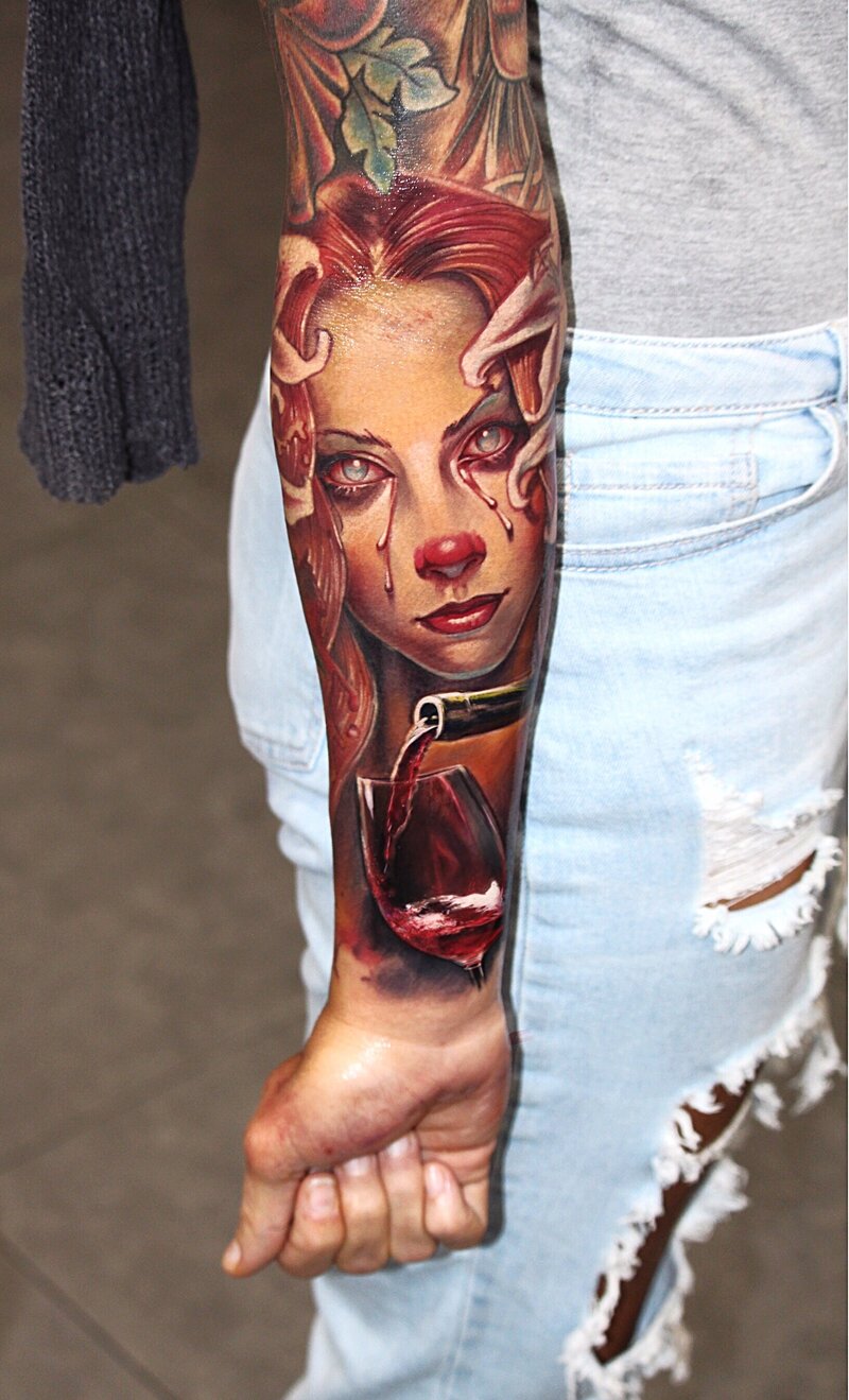 A vibrant full-color tattoo showcasing a rich palette of hues, with intricate details and shading that bring the design to life. The tattoo incorporates bold and bright colors to highlight the elements of the artwork, creating a visually striking and dynamic piece that emphasizes depth, contrast, and creativity.