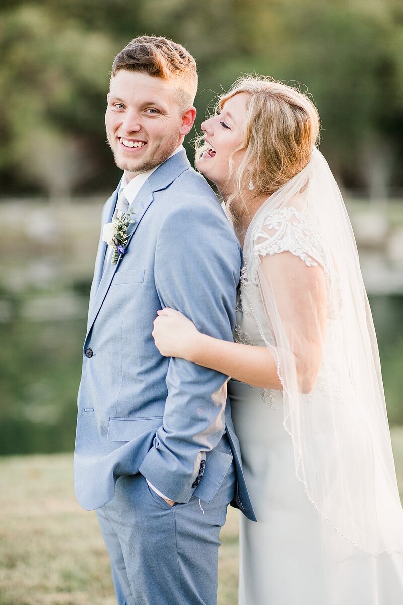 bride whispering to groom by Knoxville Wedding Photographer, Amanda May Photos