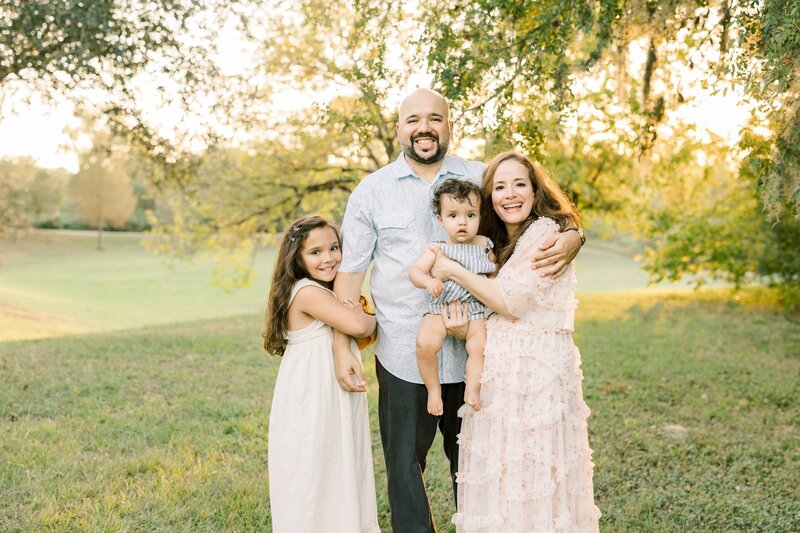 parents posing with their kids