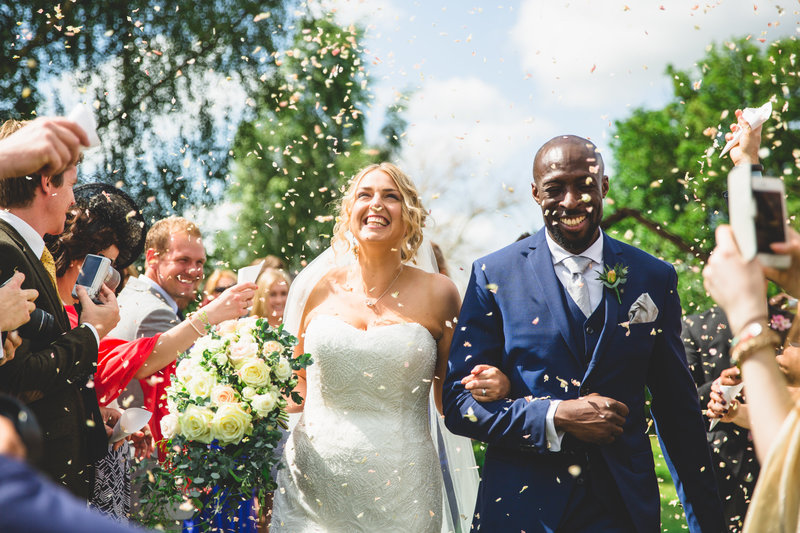 wedding photographer manchester bride and groom confetti