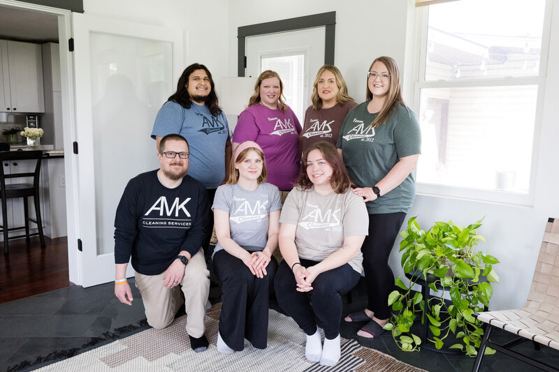 The AMK cleaning team lined up and smiling in one of the homes they deep cleaned