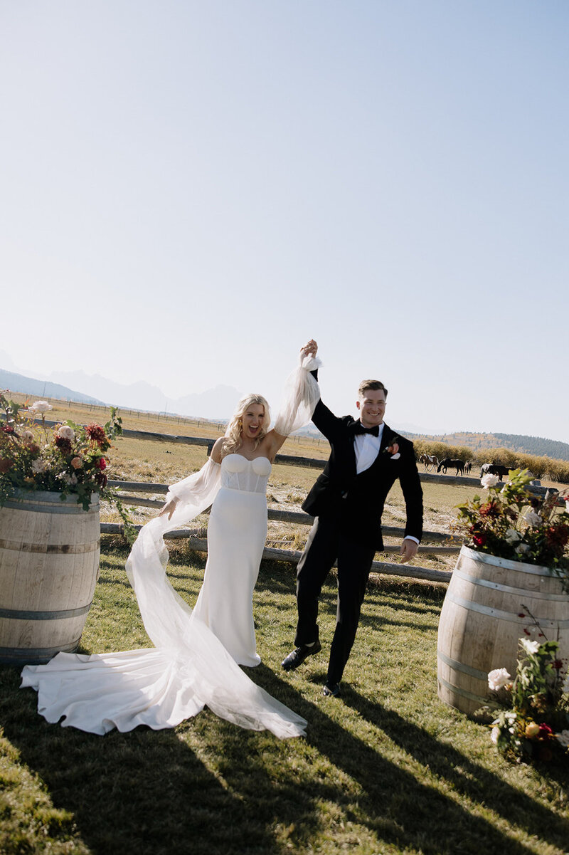 Jackson hole wedding bride and groom celebrating