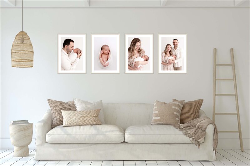 Four framed photos of family of three at their newborn session hanging above a neutral couch. The far left frame is of dad and baby, next to that is a frame of baby by themself, then a frame of mom and baby and then a frame of mom, dad and baby.
