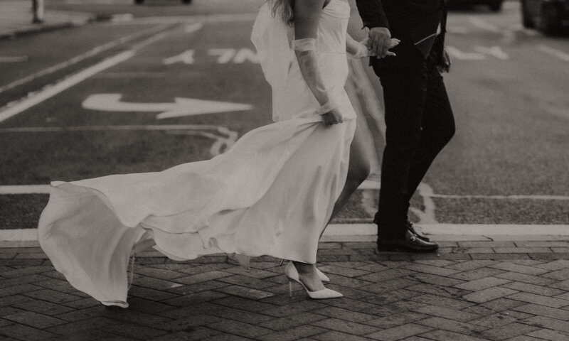 bride and groom walking on a path