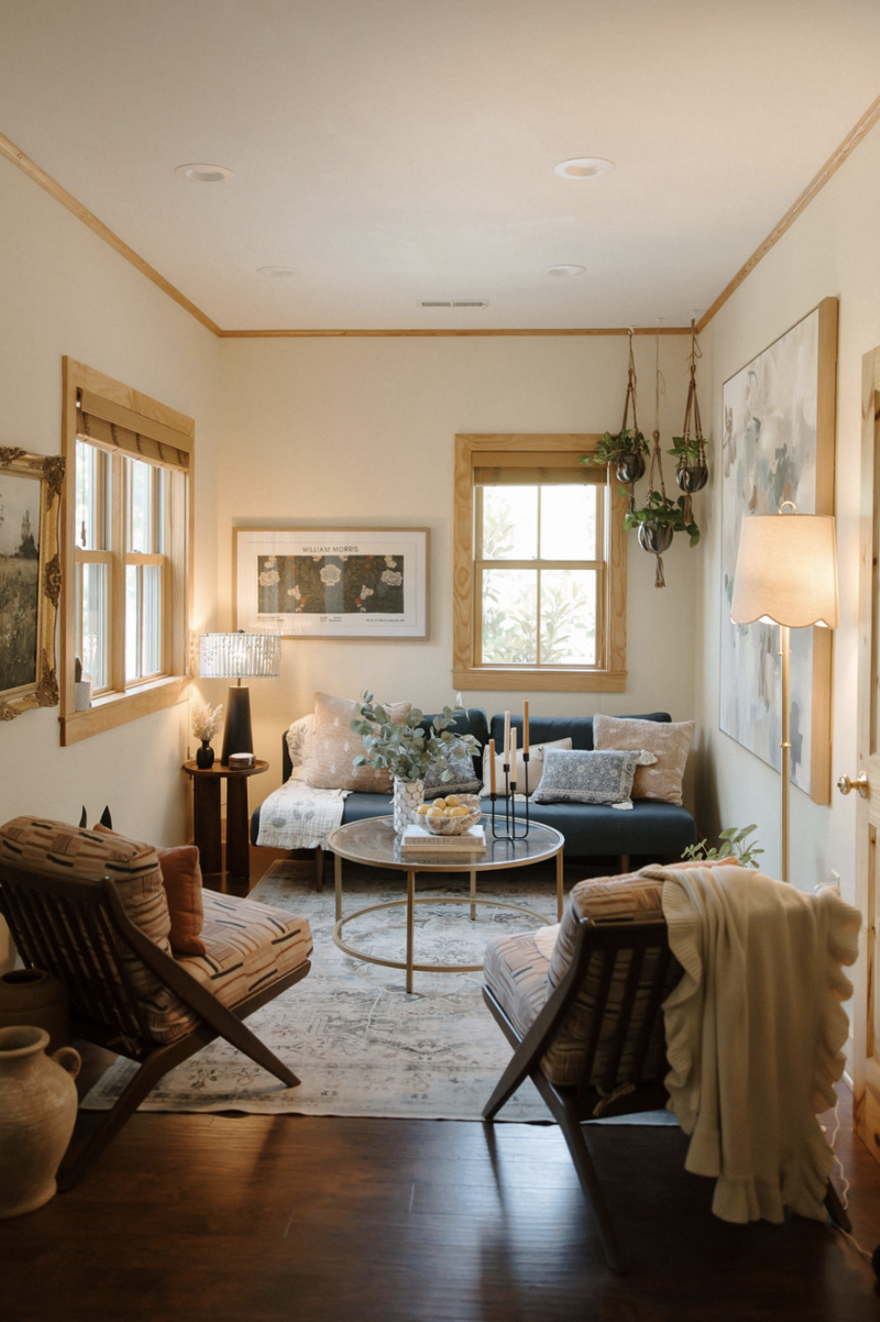 Interior sitting space at Alyn Wellness Studio with chairs, lamps, plants, and decor