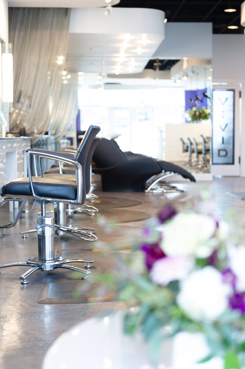 Vivid's modern salon stations with flowers.