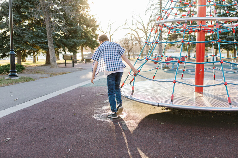 An adolescent boy playing in the park during the day, enjoying enhanced mobility.