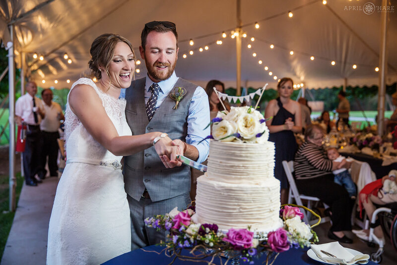 Cake Cutting at a wedding reception tent at Deer Creek Stables at Chatfield Farms