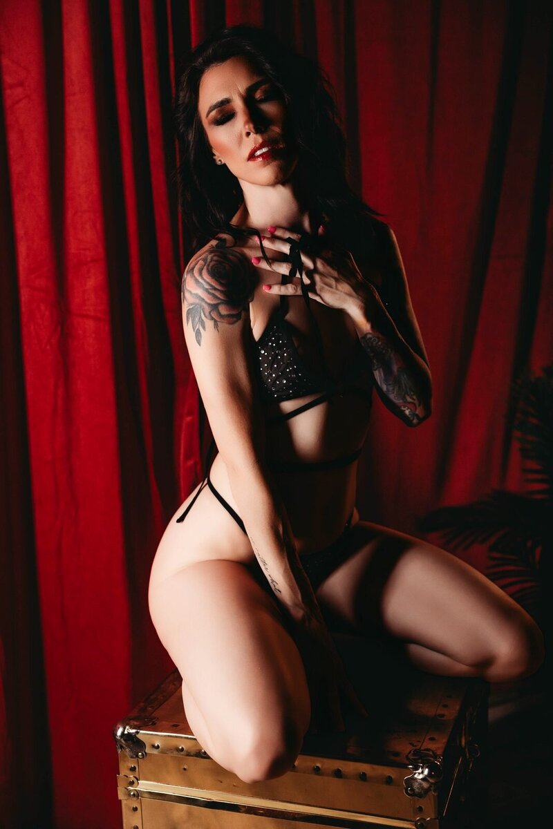 Red curtain black lace boudoir photo by Ivory & Lace Studios in Kingman, Arizona