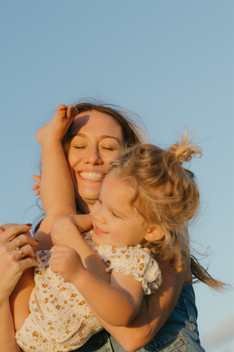Editorial-style family beach portraits in Maui, showcasing coordinated outfits and natural ocean light.