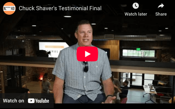 Chuck Shaver sharing his Vintage One testimonial on video at a Normal 40 in-person mastermind event