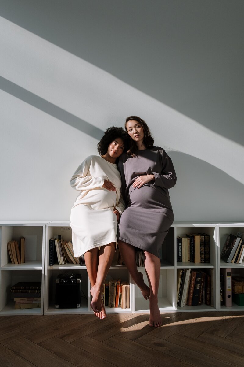 two pregnant people