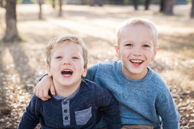 two brothers smiling for a photo