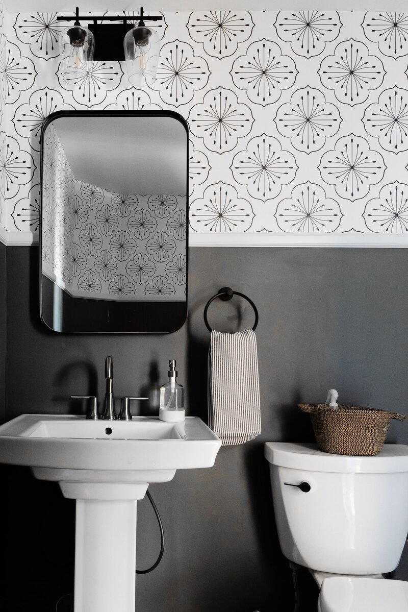 Black and White Bathroom Design with Wallpaper and Black Fixtures