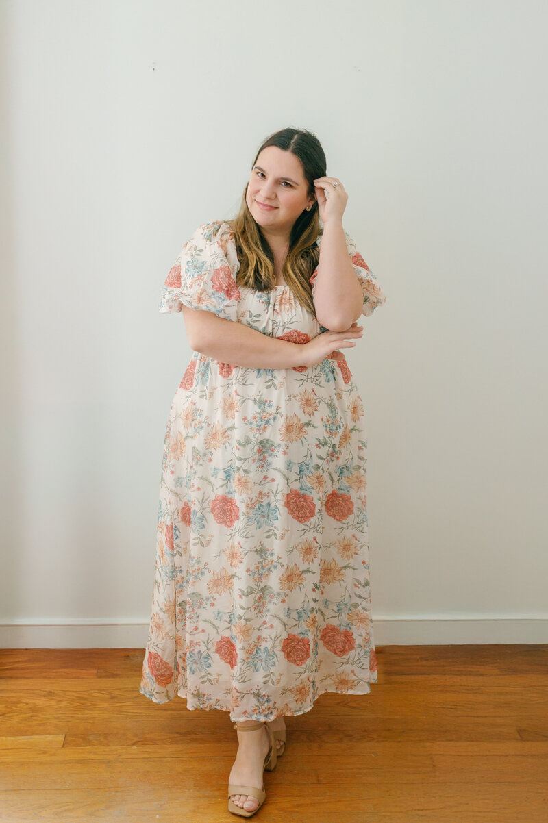 Rachael smiling in a floral dress