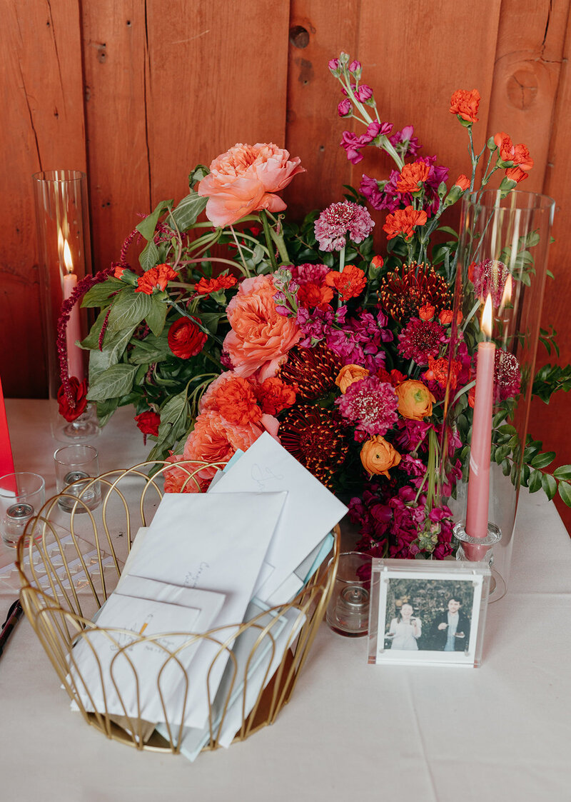Vibrant modern wedding flowers in shades of pink, red, and orange