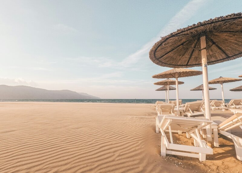 Beach chairs and umbrellas on a sandy beach