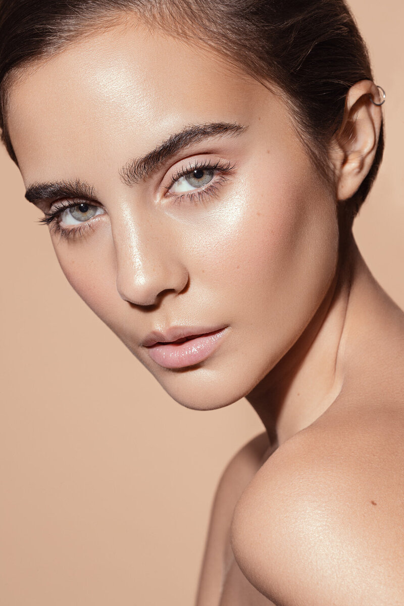 Flor in a minimalist beauty portrait, emphasizing natural makeup and a flawless complexion, shot by Ylva Erevall.
