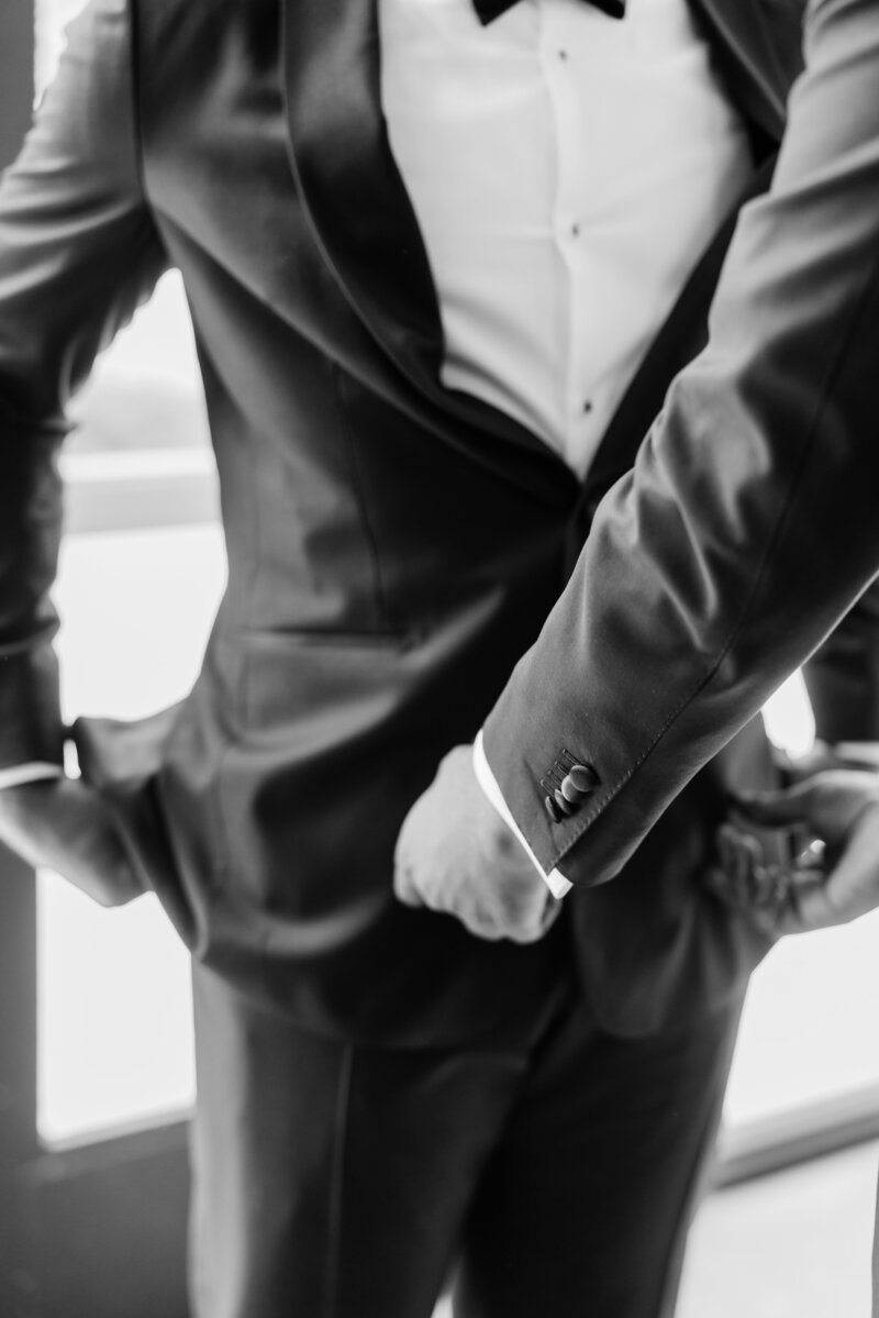 A close up photo of groom's tux while he gets ready for his wedding at the Ben, Autograph Collection in West Palm Beach