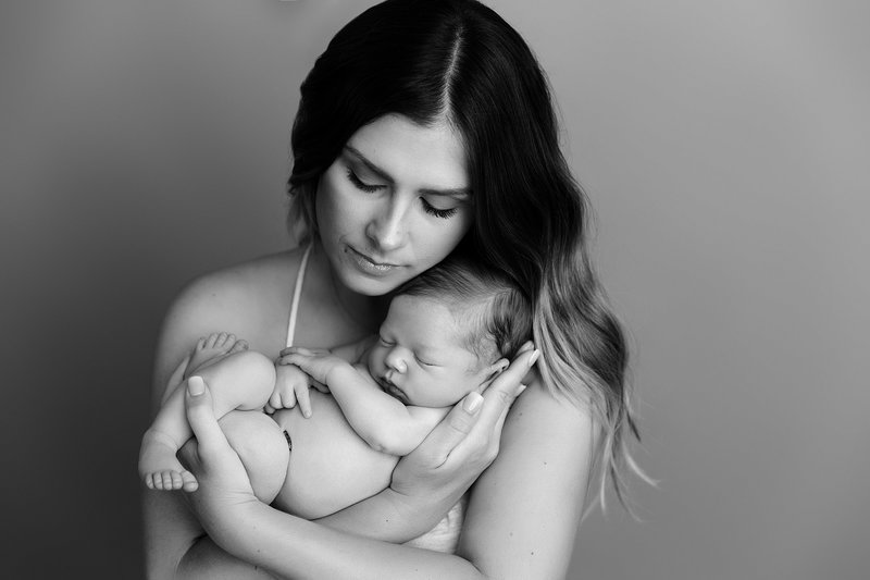 gorgeous mom with baby boy black and white