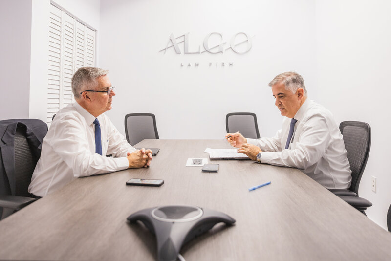 two men in a conference room