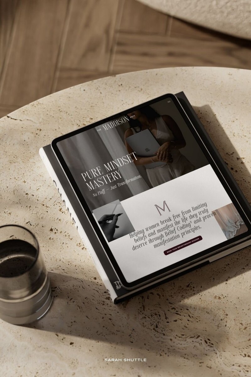 Luxury website design for The Maddison Edit shown on an iPad resting on a neutral table with refined, editorial styling.