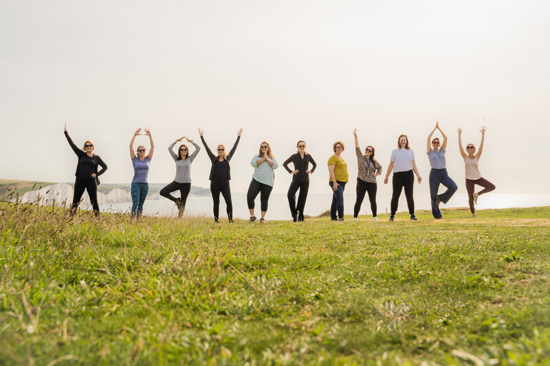 female entrepreneurs posing on cliff