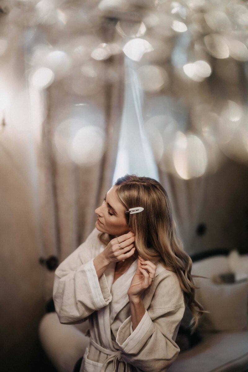 bride getting ready earrings borgo santo pietro exclusive wedding 
