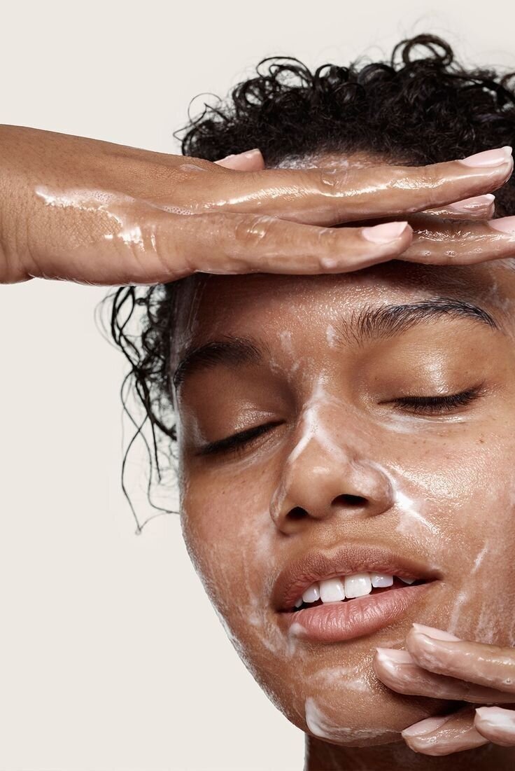 Close-up of Black woman applying skincare cream, part of inclusive beauty PR content by SA Communications