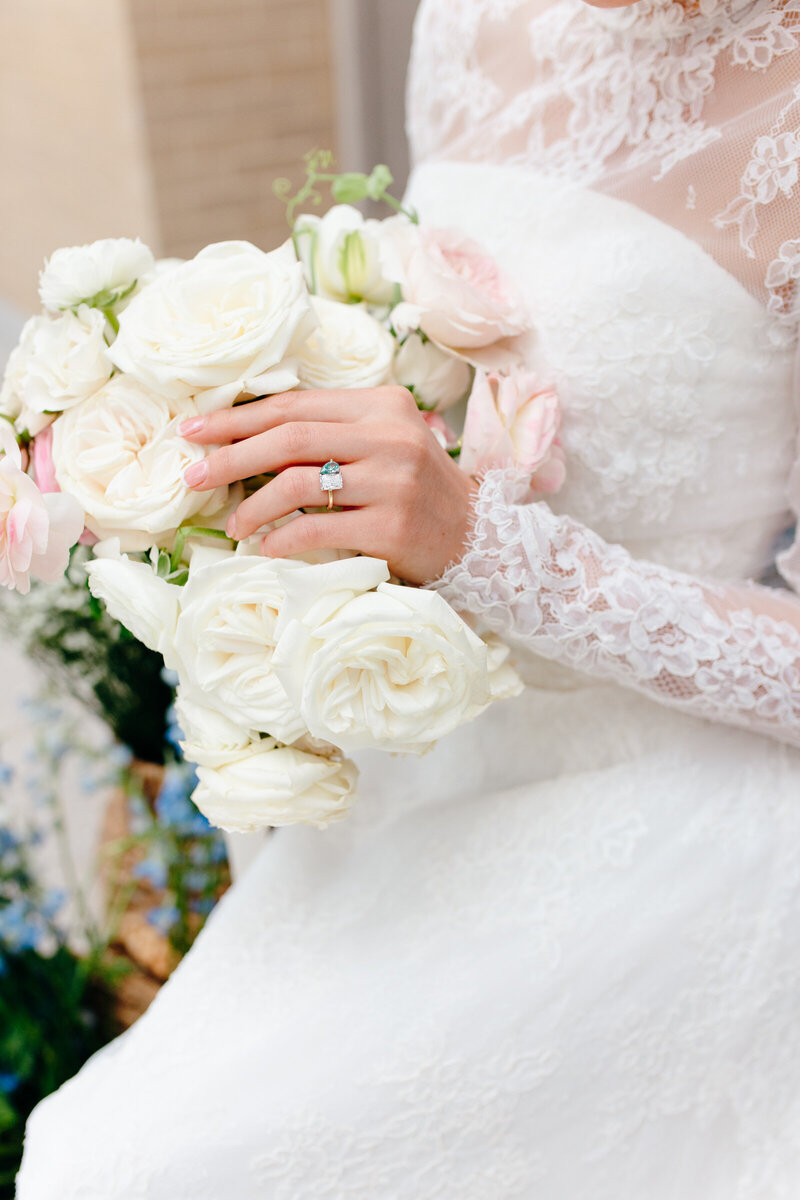 A bridal bouquet and delicate ring detail.