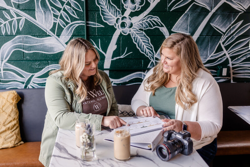 A candid shot of Meg Williamson smiling warmly as she mentors a business owner. The image captures her friendly and approachable nature, reflecting her passion and dedication to her craft.