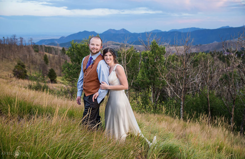 Wedding portrait of a couple posing in front of a mountain view at Colorado Mountain View in Boulder