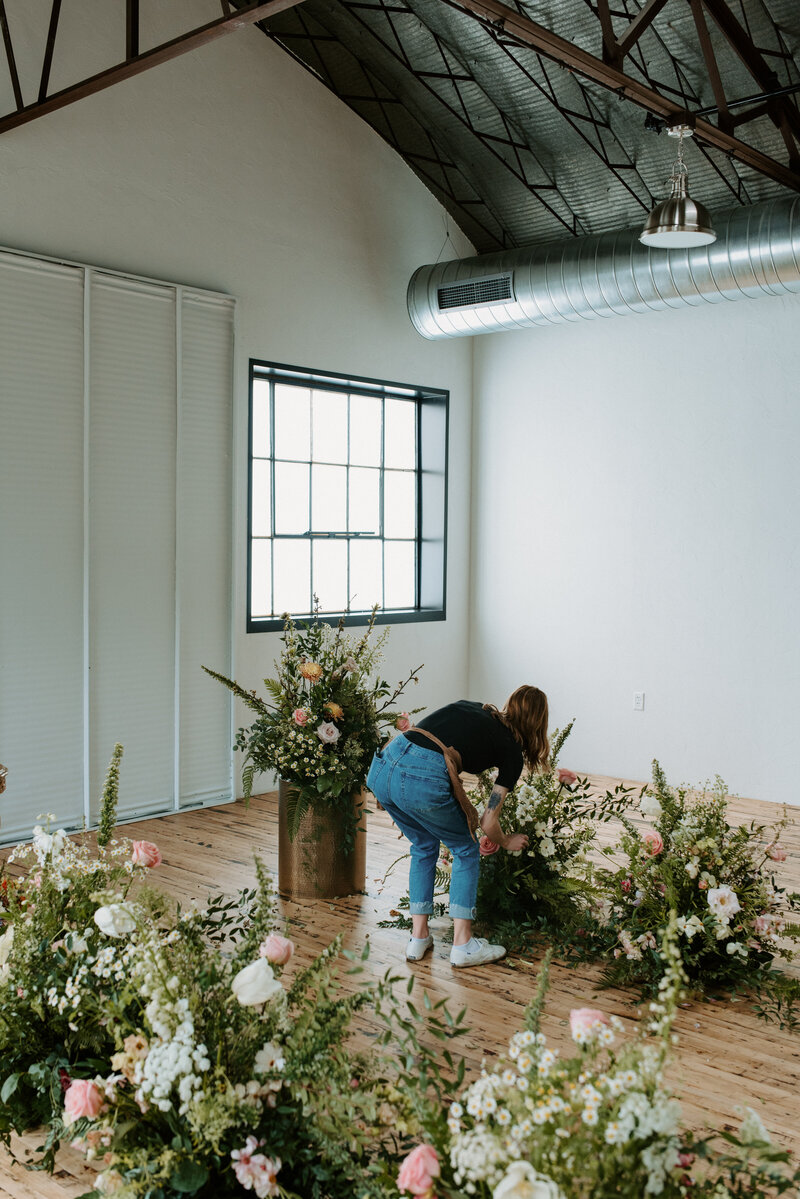 couple embracing posing in flowers