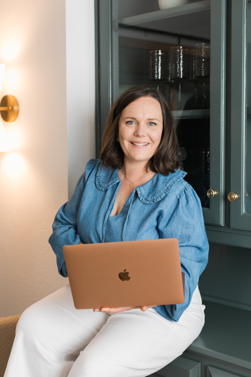 a woman working with a laptop