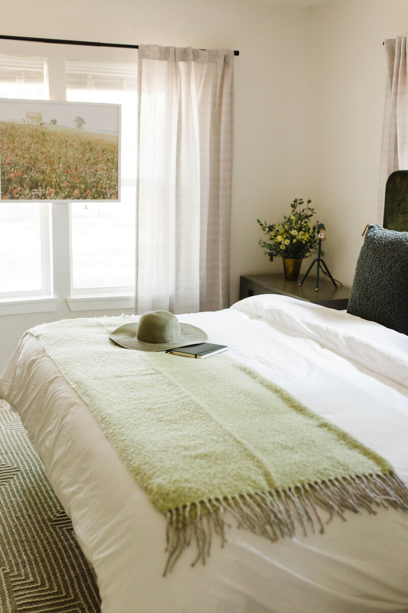 Light, green toned bedroom, designed by Hope Miriam Designs in DFW