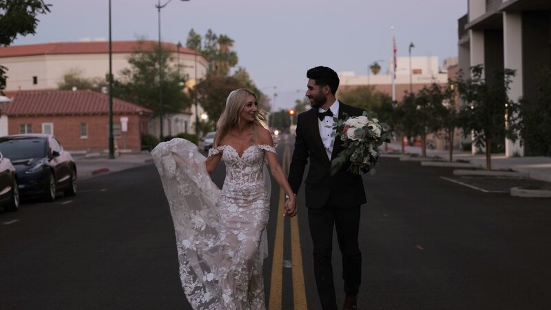 Bride and Groom Walking in the middle of a road in Meas Arizona